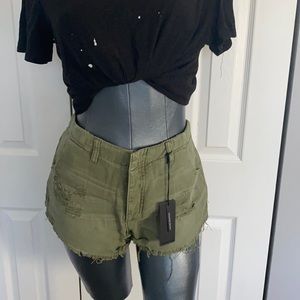 Super soft & comfy One Teaspoon distressed khaki button fly shorts.